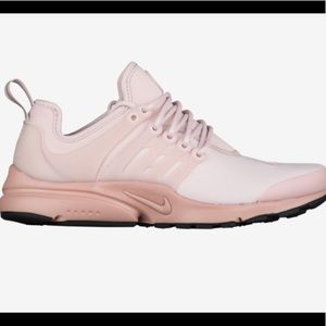 Light pink women’s Nike presto shoes